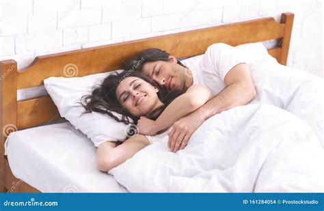 man and woman in a bed